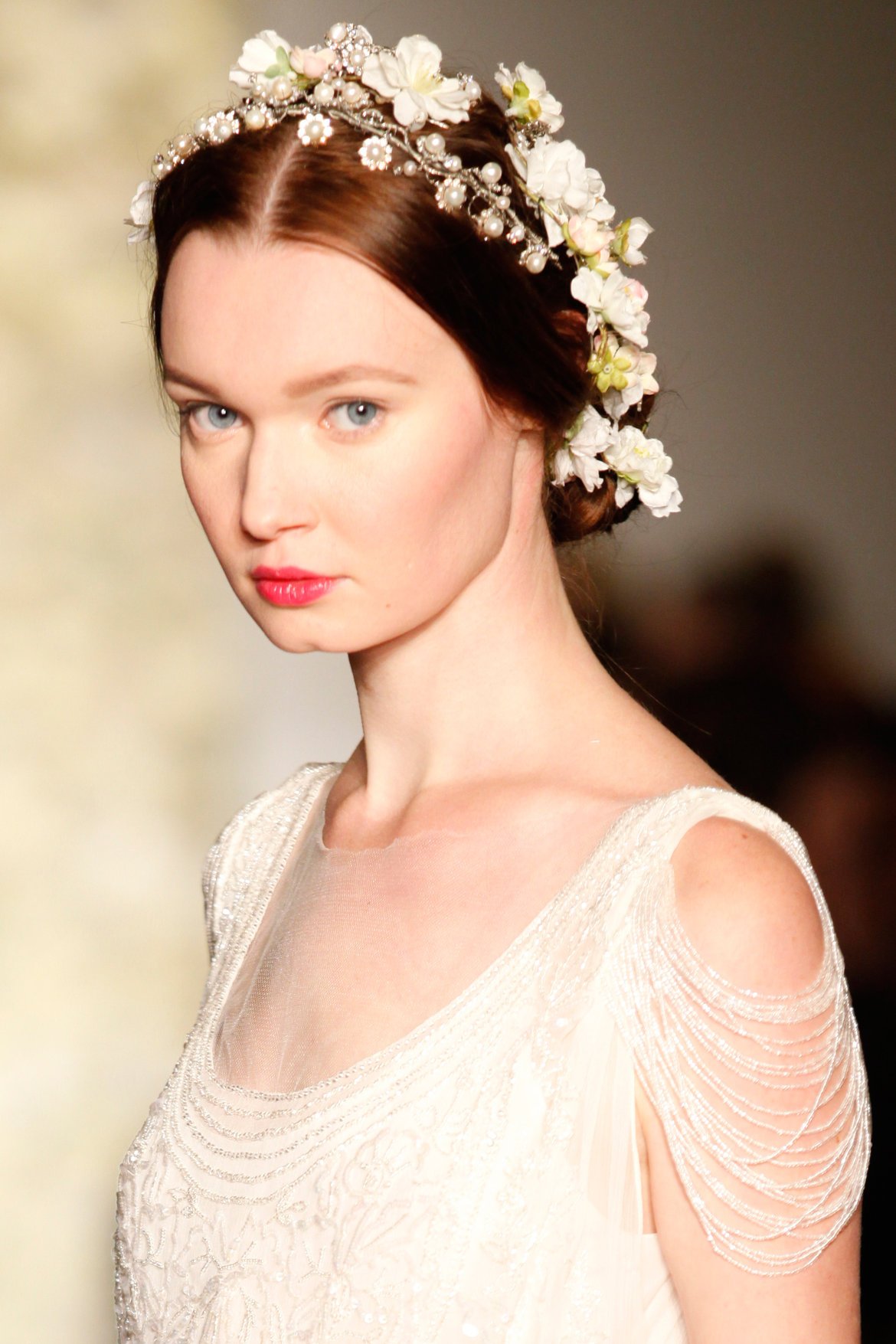 A bride with blonde hair pulled back and braided