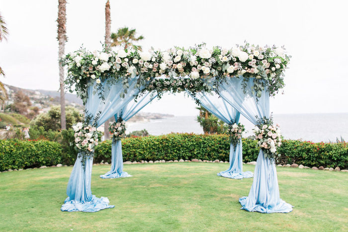 blue chiffon and blush floral wedding canopy