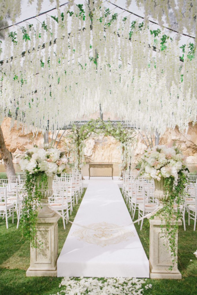 white floral and greenery wedding ceremony