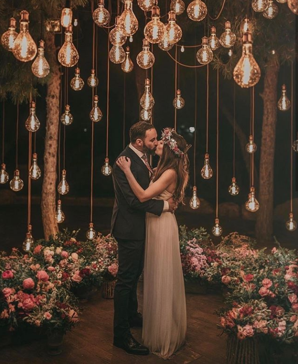 Edison bulbs create magical lighting for this couple's wedding photos