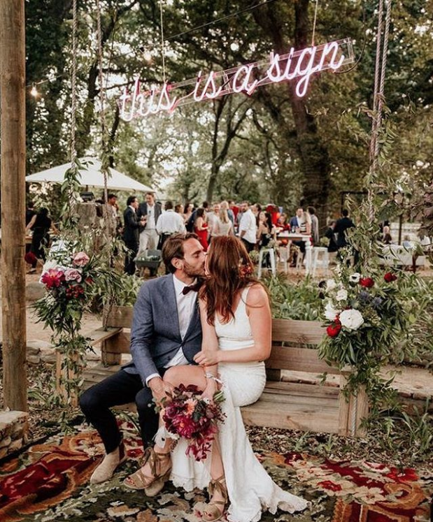 fall wedding with neon sign