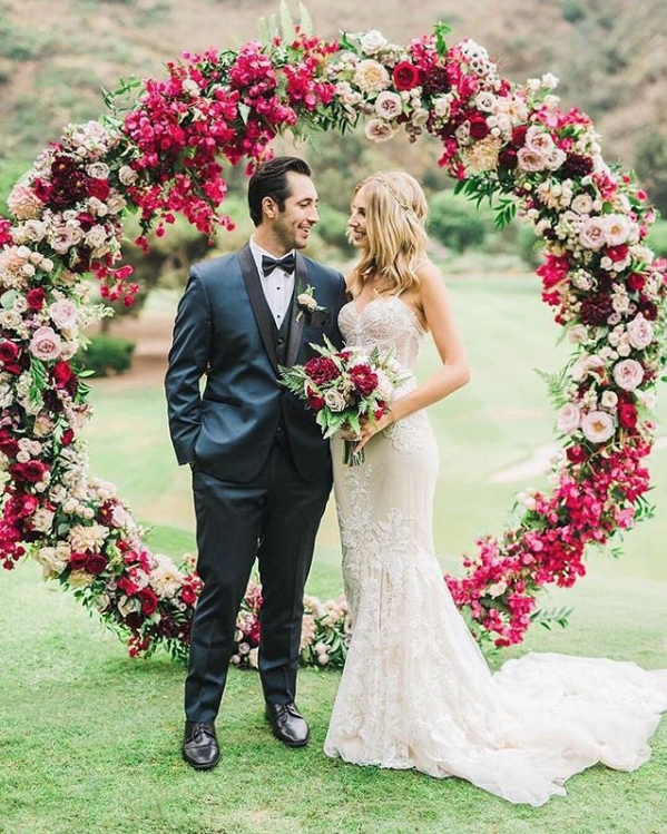 jewel tone wedding ceremony floral wreath backdrop