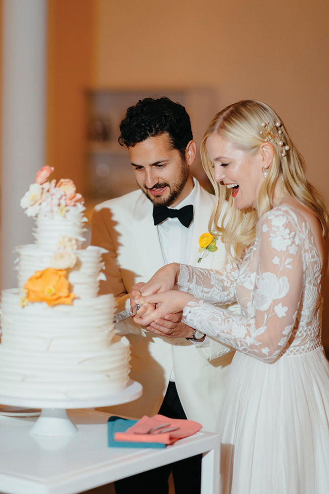 bride and groom cutting cake