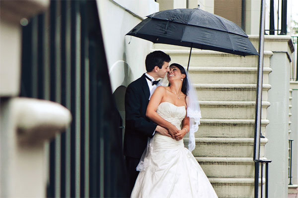 bride and groom in the rain