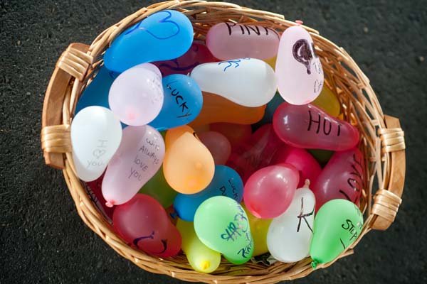 water balloons engagement photos