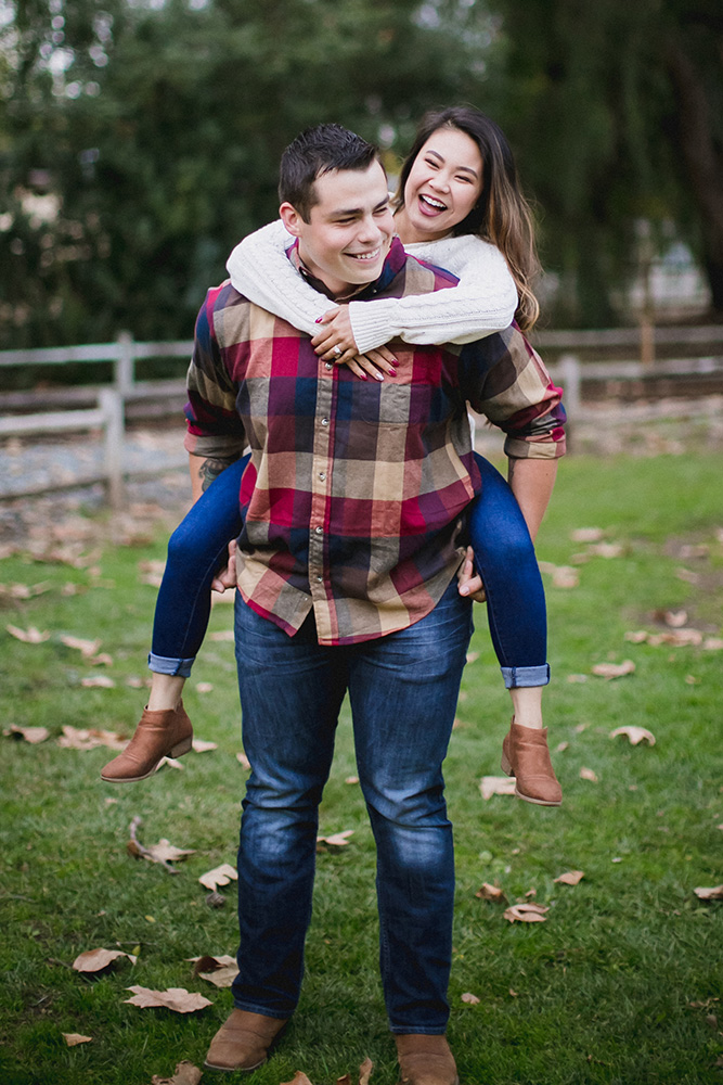 Engagement photo piggy back ride