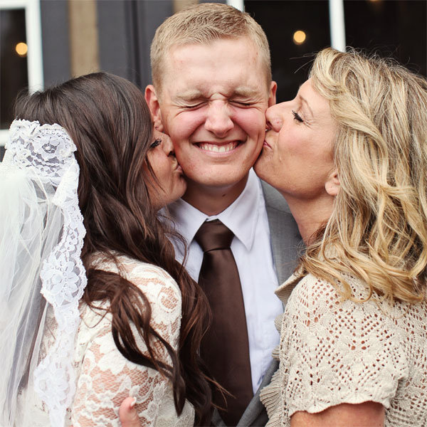 groom with bride and his mom