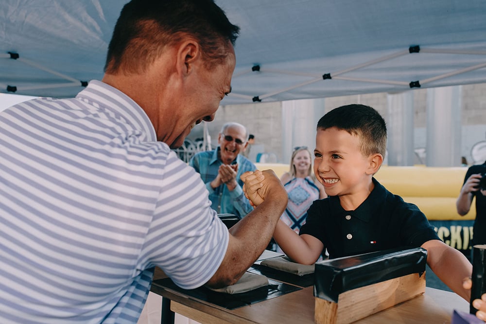 arm wrestling competition at wedding