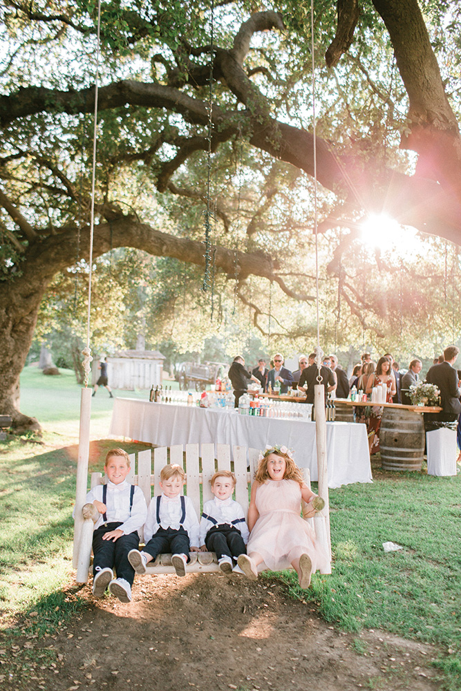 Flower girls on a swing