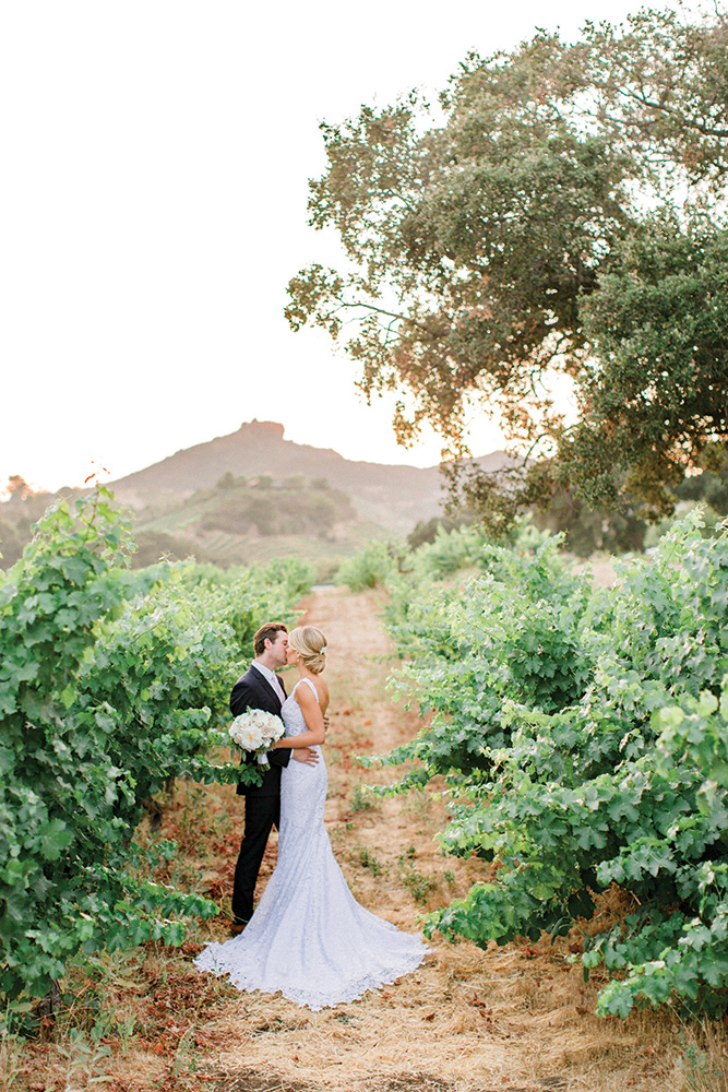 Bride and groom kissing