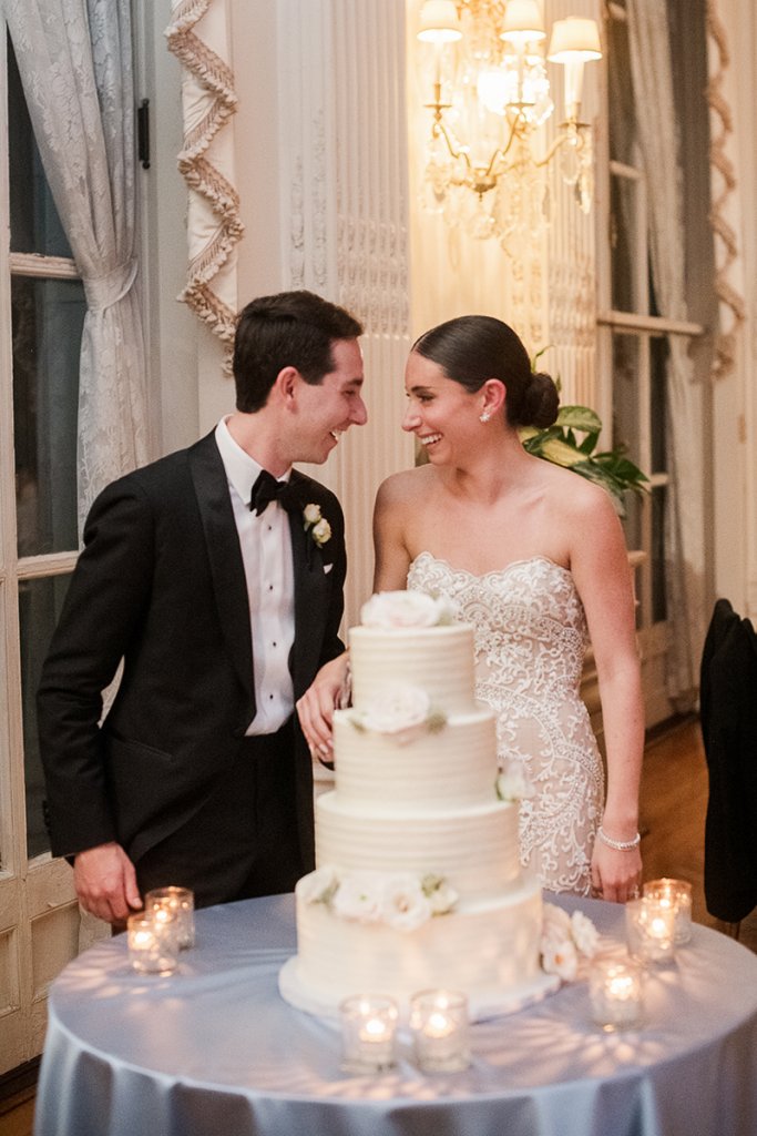 bride and groom with cake