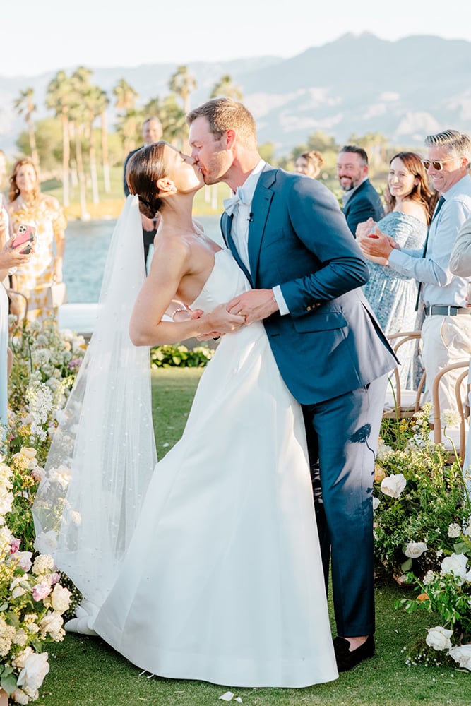 bride and groom first kiss