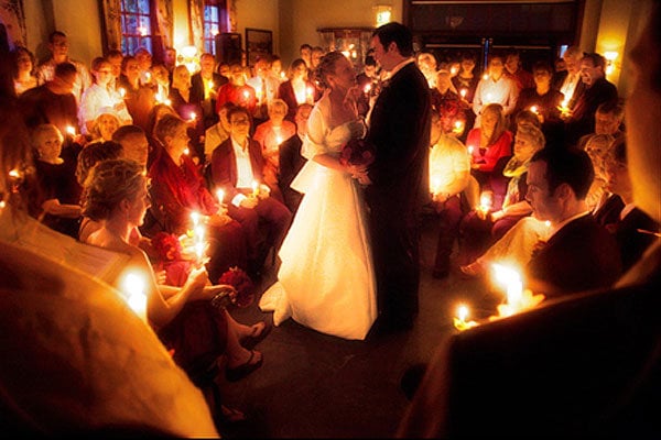 wedding guests with candles