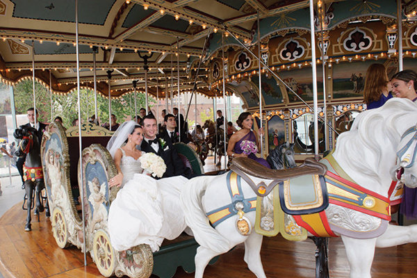 bride and groom on carousel