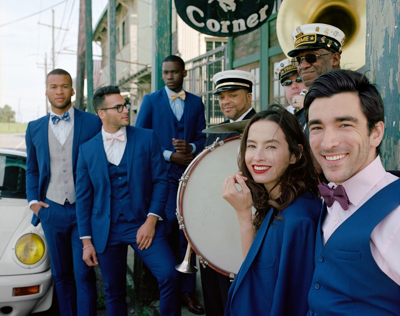 bride groom and groomsmen with brass band