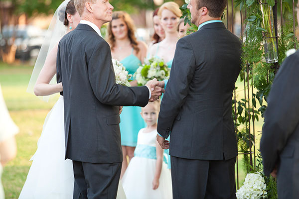 groom and father in law shaking hands