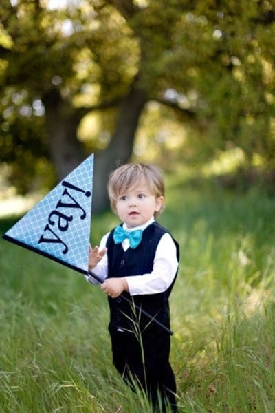 ring bearer holding a flag