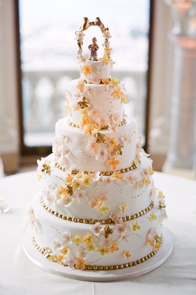 gold pink orange flowers wedding cake what to do with the top tier leftover wedding cake