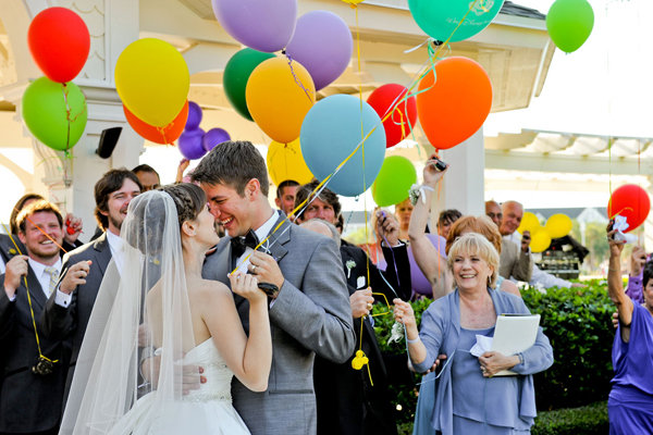 bride and groom with balloons 