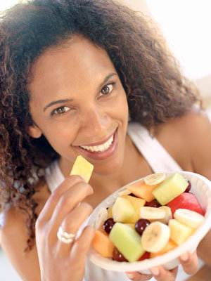 woman eating fruit