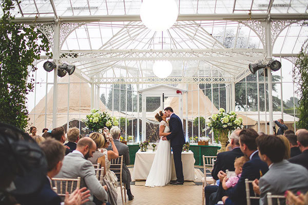 bride and groom first kiss