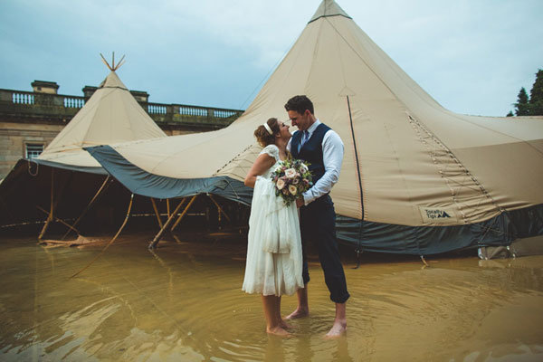 happy couple in the flooded area 