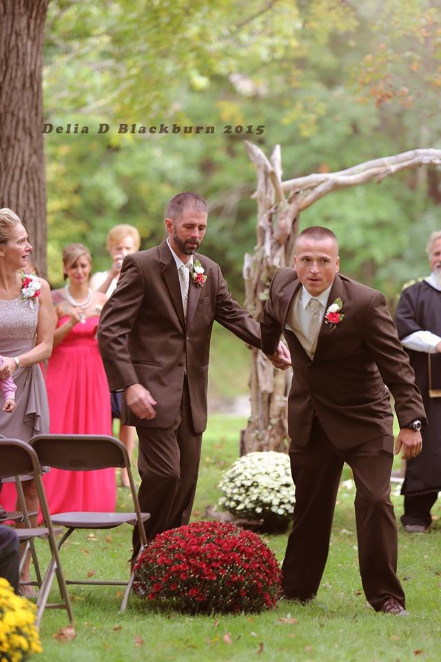brides father and stepfather walk down the aisle