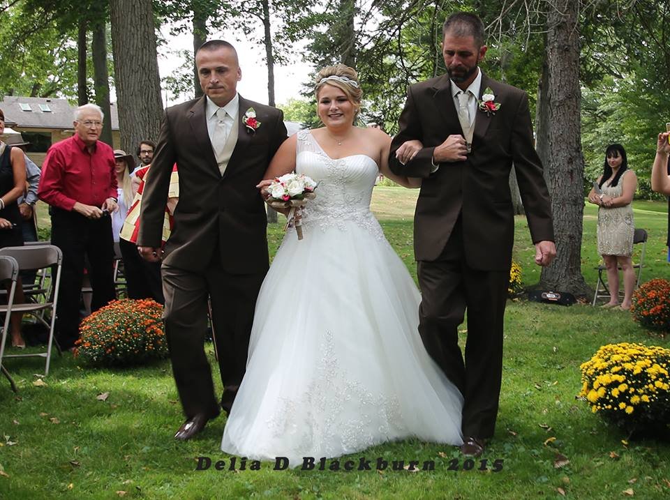 brides father and stepfather walk down the aisle