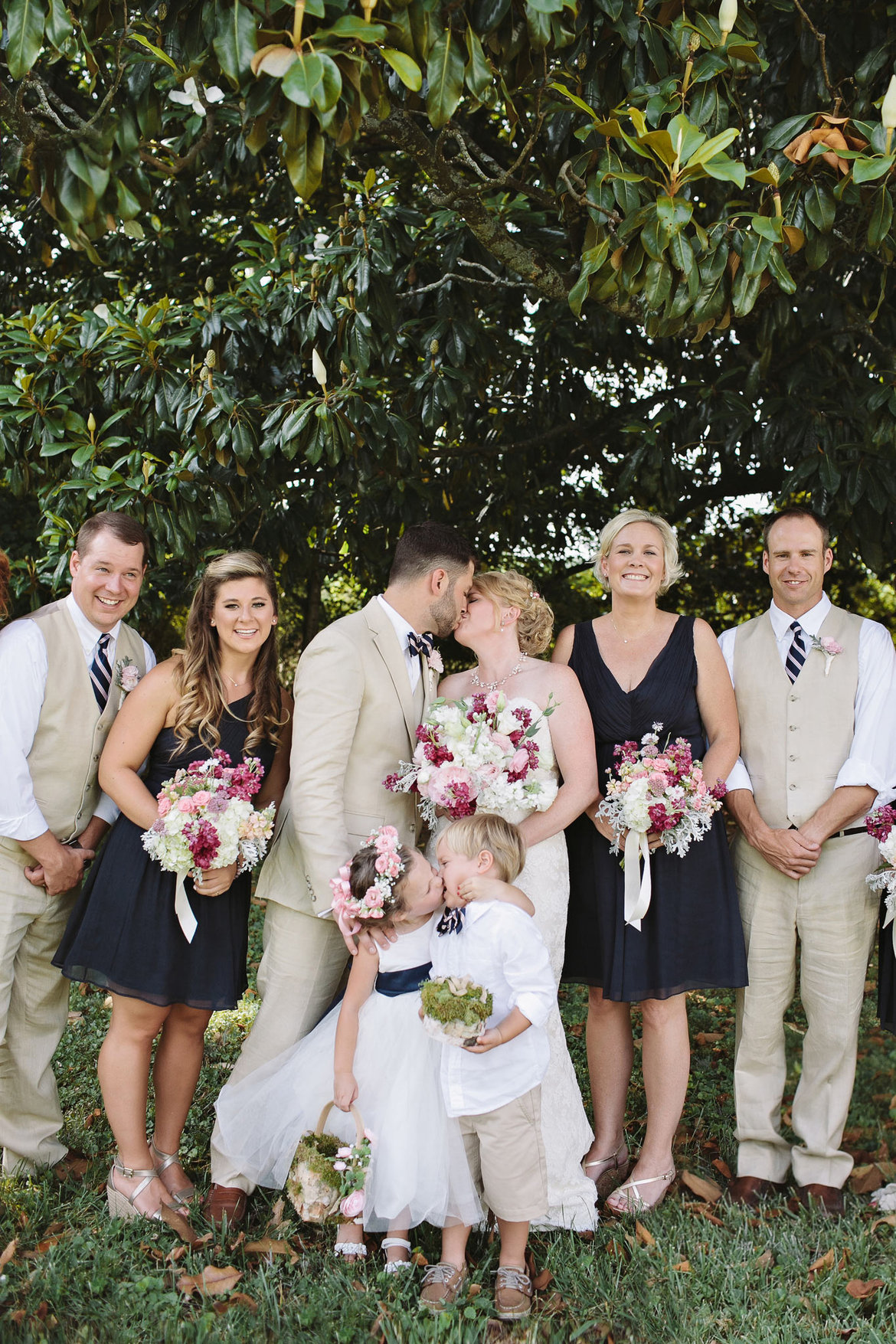 flower girl kisses ring bearer