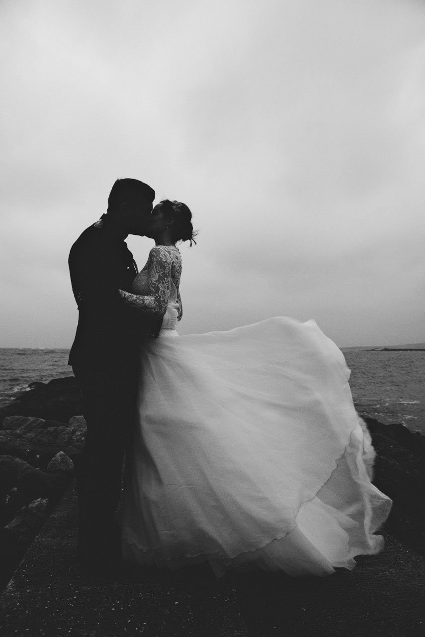 windswept photo of bride and groom