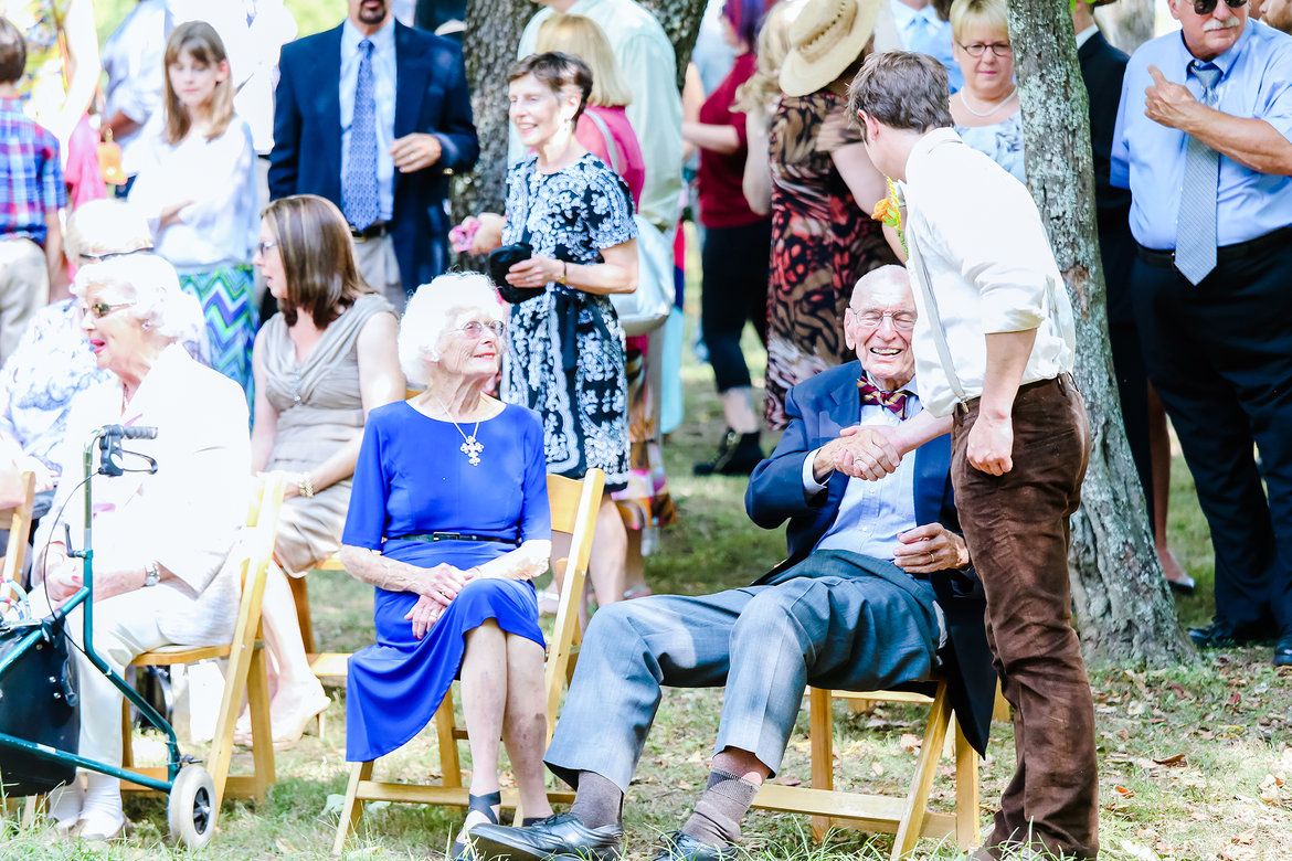 groom greeting guests