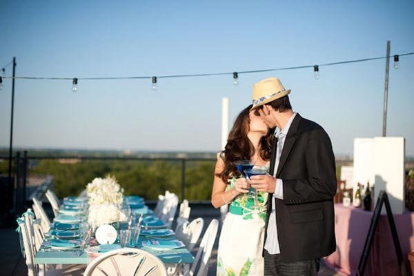 bride and groom kissing during toast