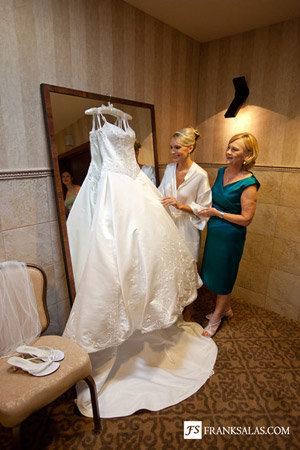 real bride kristin admiring her wedding dress