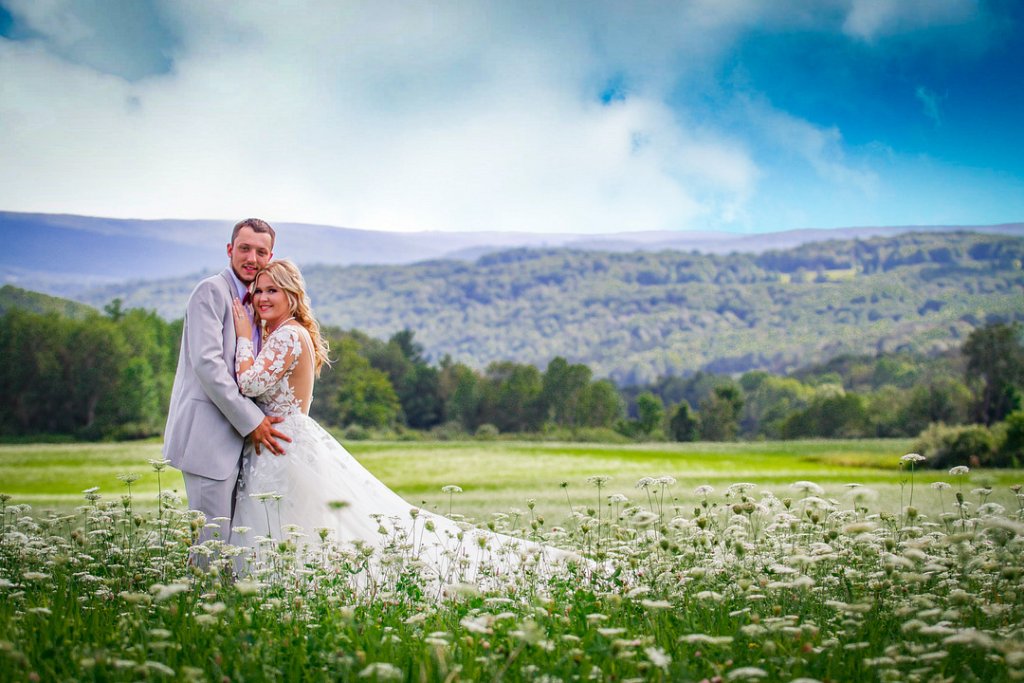 bride and groom in floral field