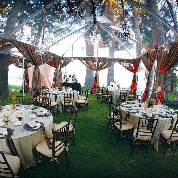 https://www.bridalguide.com/sites/default/files/potd-images/clear-tent-wedding-reception-600_0.jpg