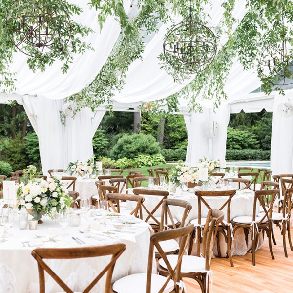 Outdoor wedding reception under tent