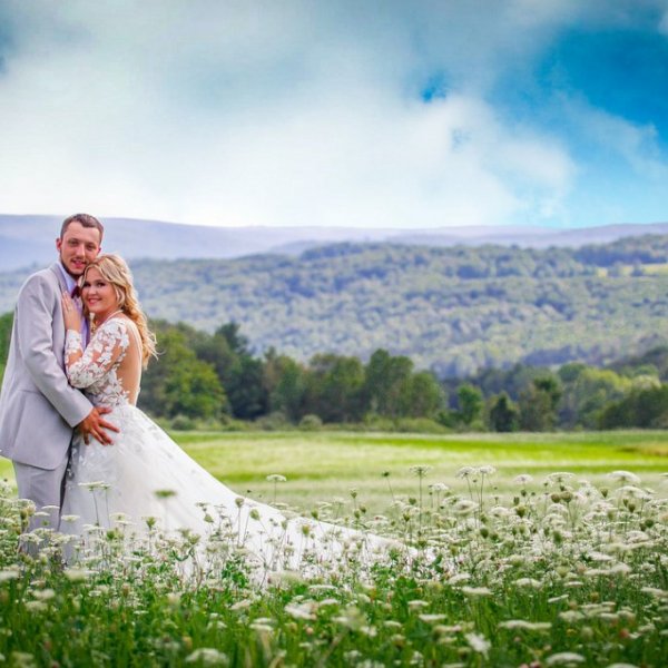 bride and groom in floral field