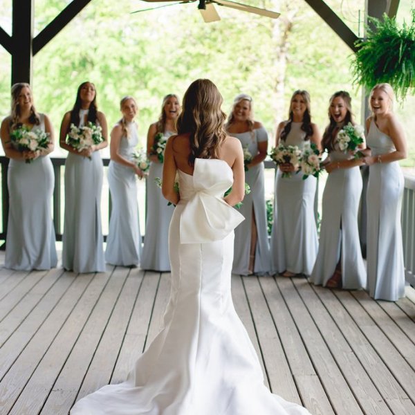 bride first look with bridesmaids