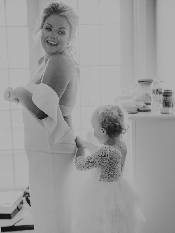 bride and flower girl getting ready for wedding bride and flower girl getting ready for wedding
