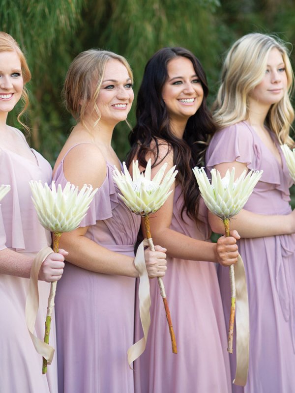 bridesmaids with king protea bouquets bridesmaids with king protea bouquets