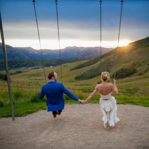 bride and groom on swings